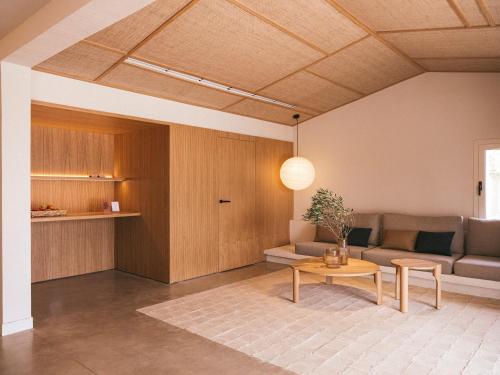 a living room with a couch and a table at wecamp Cadaqués in Cadaqués