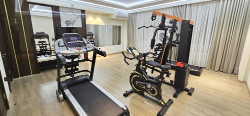 a room with a gym with a exercise bike at Анис in Khujand