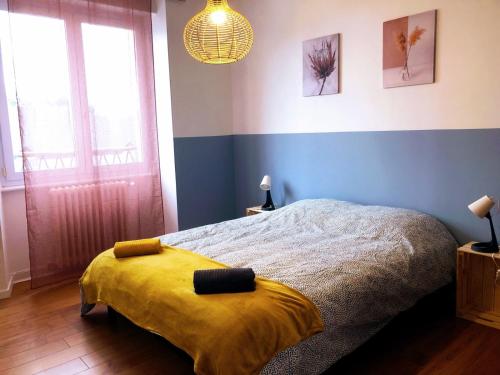 Ένα ή περισσότερα κρεβάτια σε δωμάτιο στο Gîte Les Embruns De Portsall - 5 P