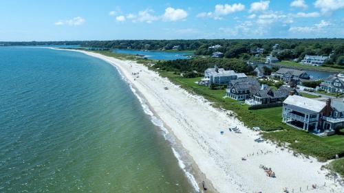 an aerial view of a beach with houses and the water at Waterfront Walk to Beach in Barnstable
