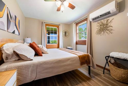 a bedroom with a bed and a window at Fishing Kayaks Firepit Paddleboat in Pierceton
