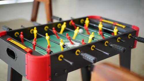 a tool rack with a bunch of yellow and red scissors at Mesteria Inn Wayanad in Wayanad