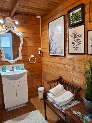 a bathroom with a sink and a mirror at Quinta do Benjamim - Tejo "For 2, family, nature or relax" in Praia do Ribatejo