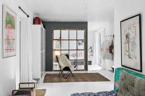 a living room with a chair and a window at 2029-Stege-Telefonstien-41 in Stege