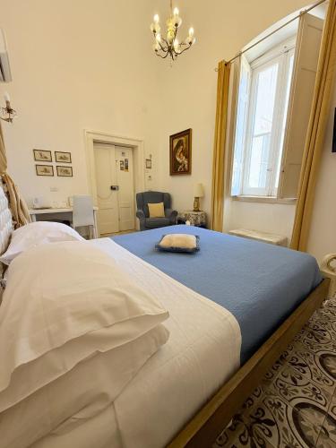 a bedroom with a large bed and a window at DONNA LUCREZIA b&b Boutique Hotel Style - relax & business stay in Bisceglie