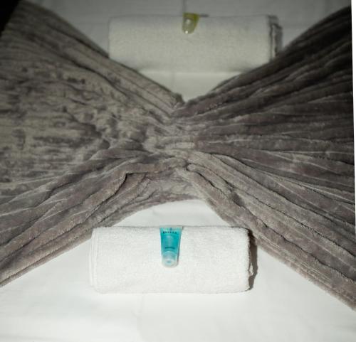 a vase sitting on top of a white towel at NISS House in Akhaltsikhe