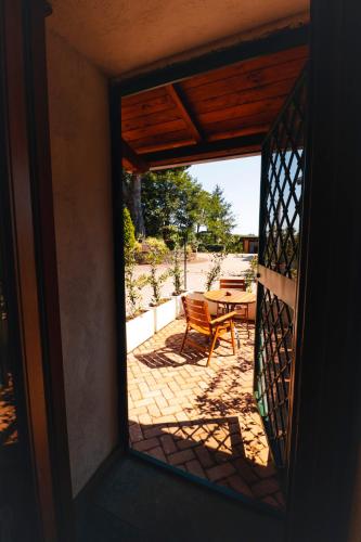 a view of a patio through a glass door at Borgo Castello Sidra GG in Artena