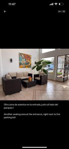a living room with a couch and a table at Monte vista in Sosúa