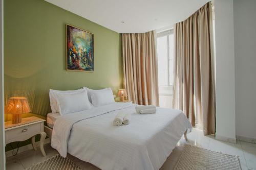 En eller flere senge i et værelse på S15 Latitude Palace - un cocon face à la mer