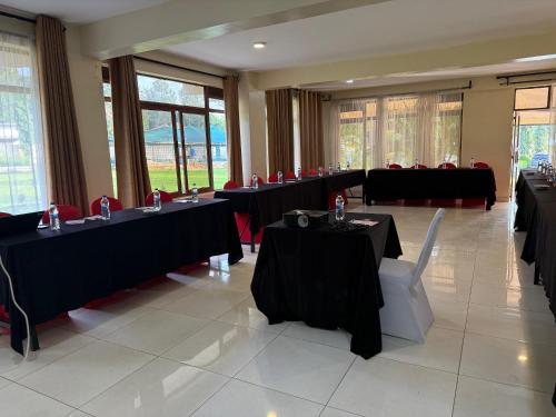 a conference room with tables and chairs at Lantana Comfy in Kakamega