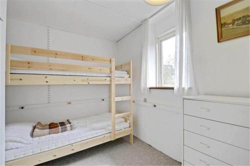 a bedroom with a bunk bed and a window at 4304-Borre-Klintevej-273 in Borre
