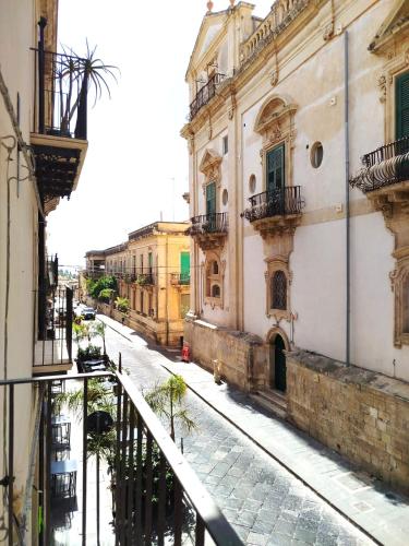 a view of a street from a balcony of a building at House&Villas - Casa Lelli in Noto