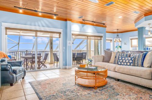 a living room with a couch and a table at Sunrise Shores in Carrabelle