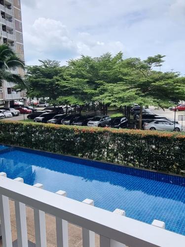 a view of a pool from a balcony of a parking lot at Supalai Park Phuket City 2 bedrooms for rent in Phuket