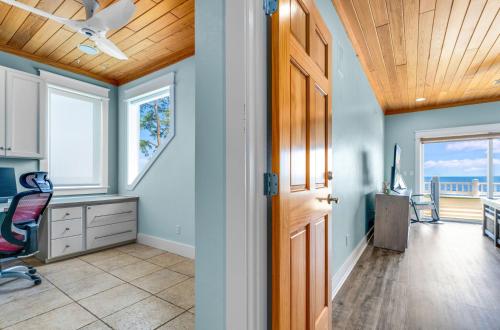 a hallway with a door and a desk and a chair at Sunrise Shores in Carrabelle