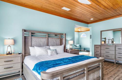 a bedroom with a large bed with a wooden ceiling at Sunrise Shores in Carrabelle