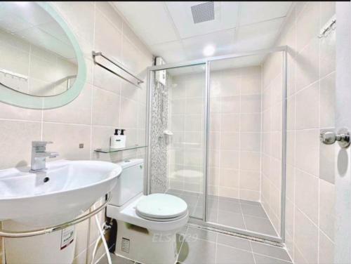 a bathroom with a shower and a toilet and a sink at Supalai Park Phuket City 2 bedrooms for rent in Phuket