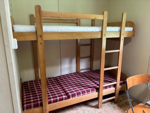 a couple of bunk beds in a room at Kemp Chatky Nové Město in Náchod