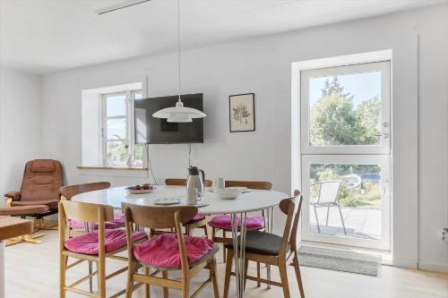 a kitchen and dining room with a table and chairs at 8217-Vordingborg-Kvaedevej-10 in Vordingborg