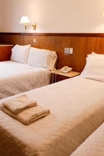 Postel nebo postele na pokoji v ubytování Cordoba Yolanda Hotel