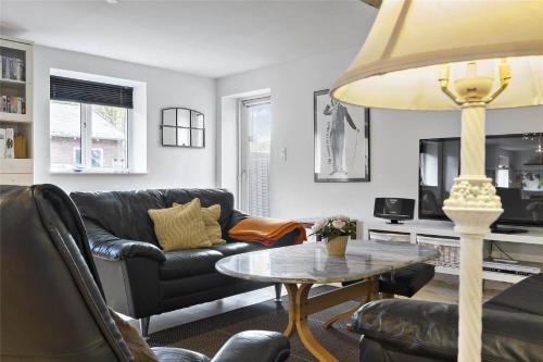 a living room with a couch and a table at 8002-Kalvehave-Sondre-Led-4 in Kalvehave