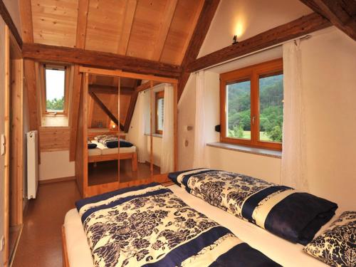 Ένα ή περισσότερα κρεβάτια σε δωμάτιο στο Ferienhaus am Kropbach