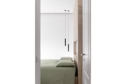a bedroom with a bed and a window at Via del Pontile in Nesso
