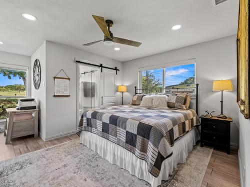 a bedroom with a bed and a window at Farmers Branch 10th Tee Golf Retreat in Farmers Branch