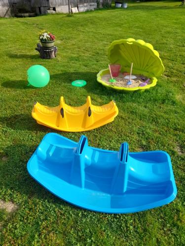 two inflatable trampolines on the grass in a yard at Domek u Socków in Zakopane