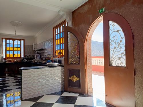 an entrance to a kitchen with an open door at Assif Iboudrarn in Sidi Ifni