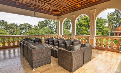 an empty room with chairs and windows at Muthu Sovereign Suites & Spa, Limuru Road, Nairobi in Limuru