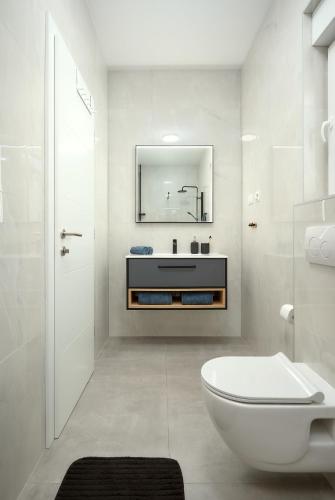 a white bathroom with a sink and a toilet at Villa Ante Vodice in Vodice