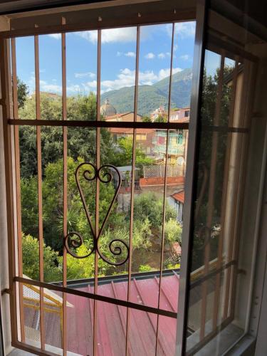 a window with a view of a mountain view at Hotel Annunziata in Massa