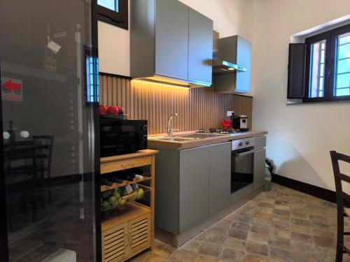 a kitchen with a sink and a counter top at Agriturismo Travaglianti Alloggio Etna in Ragalna