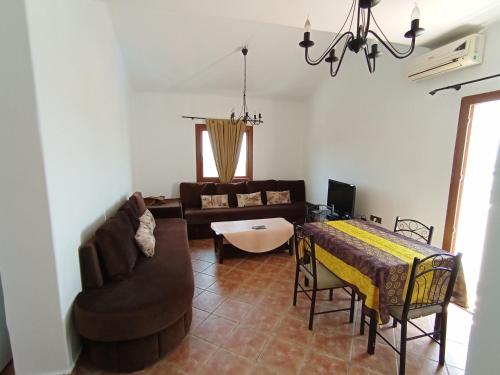 a living room with a couch and a table at Cabo Dream cabo in Cabo Negro