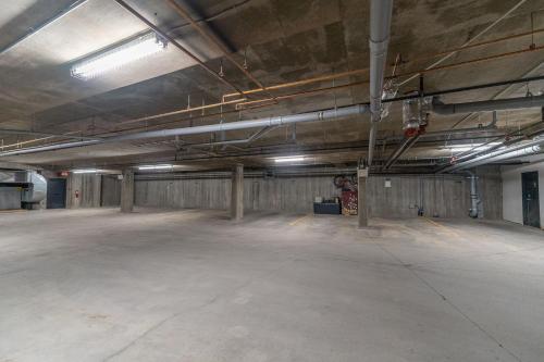 an empty parking lot in an empty parking garage at Alpine Village Condo by Canadian Rockies Vacation Rentals in Canmore