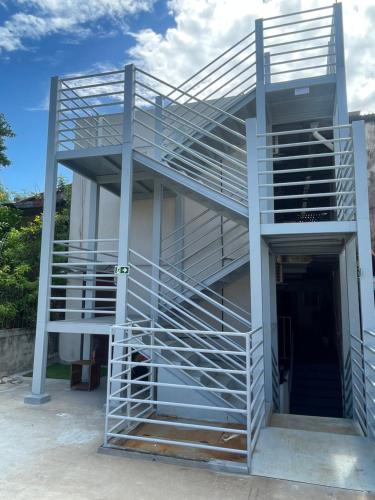 a staircase on the side of a building at Encanto da Praia hotel pousada in Natal