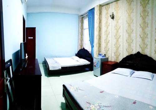 Voodi või voodid majutusasutuse Khách Sạn THU NGUYỄN - BẾN NINH KIỀU toas