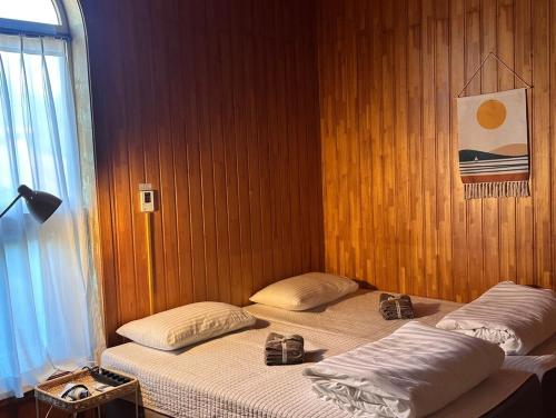 Postel nebo postele na pokoji v ubytování Jeju Songdangsongdang Pension and Resort