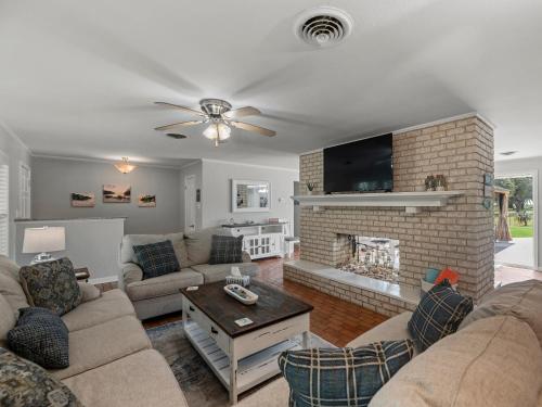 a living room with a couch and a fireplace at The Sea Glass House in Rockport