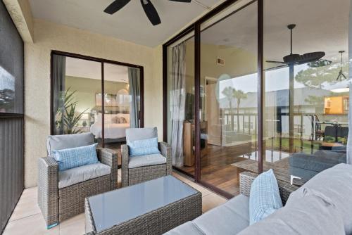 a living room with a couch and chairs at Siren’s Song, Minutes to IMG & Anna Maria Island in Bradenton