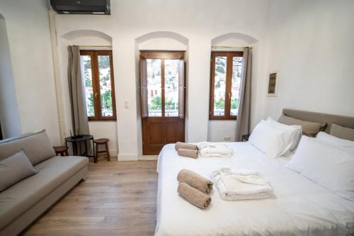 Ένα ή περισσότερα κρεβάτια σε δωμάτιο στο La Casa di Symi