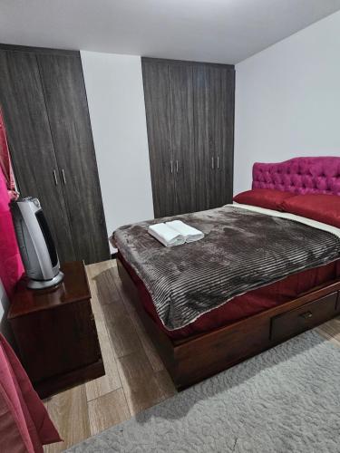 a bedroom with a bed and a tv in it at Casa Lina in Boca Monte
