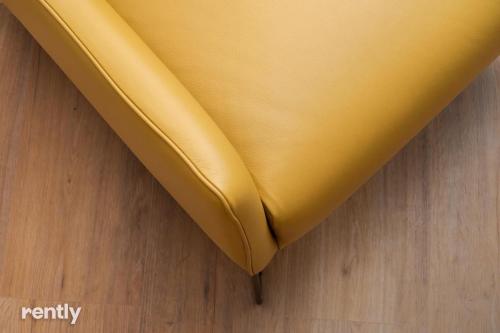a piece of yellow fabric sitting on top of a wooden floor at Luxury Apartments And Studios At Sea Side By Rently in Eilat