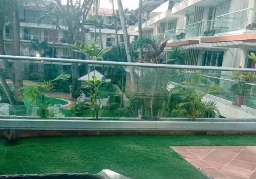 a view from a window of a building with a yard at ETERNAL WAVE CALANGUTE A Block 204 in Calangute