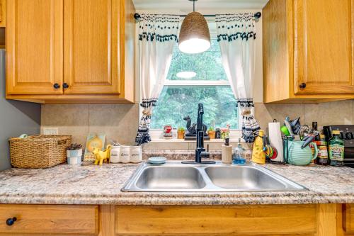 a kitchen counter with a sink and a window at 10 Mi to Crystal River Home in Citrus County in Beverly Hills