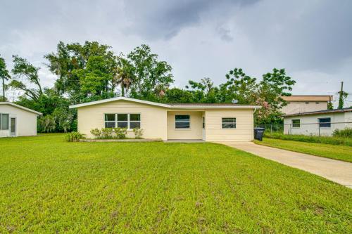 a house with a large yard with a driveway at 10 Mi to Crystal River Home in Citrus County in Beverly Hills