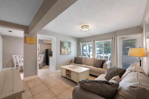 a living room with a couch and a table at A Beach Retreat on Casey Key in Venice