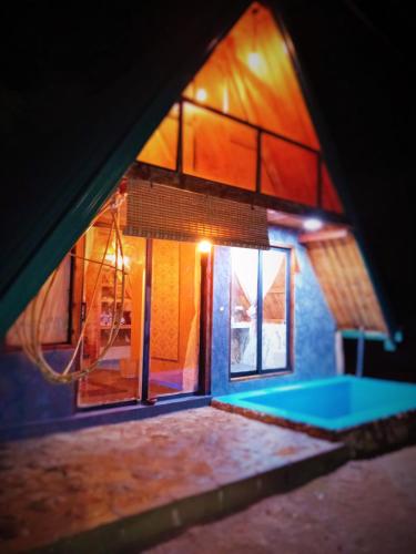a view of a house with a swimming pool at Ella Shia Cabana in Badulla