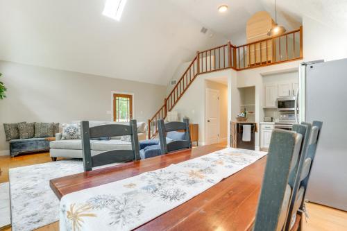 a kitchen and living room with a table and chairs at Pet-Friendly Lake Monticello Home with Perks! in Zion Crossroads